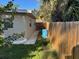 Yard features green grass and wood fence at 7126 Oelsner St, New Port Richey, FL 34652