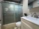 Bathroom featuring a clear shower stall, sink, and stylish finishes at 7126 Oelsner St, New Port Richey, FL 34652