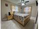 Comfortable bedroom featuring natural light, a ceiling fan, and neutral-toned walls at 7126 Oelsner St, New Port Richey, FL 34652