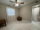 Bright bedroom space featuring tiled floors, natural light, and neutral color at 7126 Oelsner St, New Port Richey, FL 34652