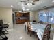 Bright and airy dining area adjacent to the kitchen, featuring a table set for a meal at 7126 Oelsner St, New Port Richey, FL 34652