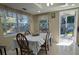 Bright and airy dining area adjacent to the kitchen, featuring a table set for a meal at 7126 Oelsner St, New Port Richey, FL 34652