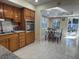 Bright and airy dining area adjacent to the kitchen, featuring a table set for a meal at 7126 Oelsner St, New Port Richey, FL 34652