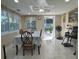 Bright and airy dining area adjacent to the kitchen, featuring a table set for a meal at 7126 Oelsner St, New Port Richey, FL 34652