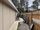 Exterior home shot showing the side of the house and fence at 7126 Oelsner St, New Port Richey, FL 34652