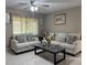 Inviting living room featuring neutral decor, tiled floors, and comfortable seating arrangements at 7126 Oelsner St, New Port Richey, FL 34652