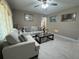 Spacious living area with tile flooring, plush seating, and elegant accents at 7126 Oelsner St, New Port Richey, FL 34652