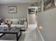 Cozy living room with neutral tones, comfortable seating, and decorative artwork creating a relaxing atmosphere at 7126 Oelsner St, New Port Richey, FL 34652