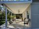 Outdoor patio featuring overhead fans, a concrete flooring, and chairs at 7126 Oelsner St, New Port Richey, FL 34652