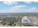Aerial view showing the neighborhood featuring homes, a shopping center and lush landscaping at 766 86Th N Ave, St Petersburg, FL 33702