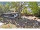 Overhead view of the backyard with a shed, mature trees, and lush landscaping, including a shed at 766 86Th N Ave, St Petersburg, FL 33702