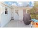 The backyard includes a patio, a door to the house, and a barbecue at 766 86Th N Ave, St Petersburg, FL 33702
