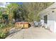 Backyard featuring a covered patio, hot tub, chairs and table at 766 86Th N Ave, St Petersburg, FL 33702