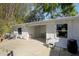 The backyard features a covered patio, a lush green lawn, and privacy at 766 86Th N Ave, St Petersburg, FL 33702