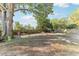 Large backyard features mature trees, a swing, and a picnic table at 766 86Th N Ave, St Petersburg, FL 33702