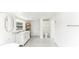 Bright bathroom featuring a walk-in shower, stylish vanity, and tile flooring at 766 86Th N Ave, St Petersburg, FL 33702