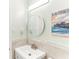Bright bathroom featuring modern fixtures, and a stylish mirror at 766 86Th N Ave, St Petersburg, FL 33702