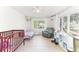 Bright, well-lit room featuring neutral colors and a large window with outdoor views at 766 86Th N Ave, St Petersburg, FL 33702