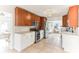 Well-lit kitchen boasts stainless steel appliances, granite countertops, and ample cabinet space at 766 86Th N Ave, St Petersburg, FL 33702