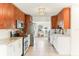 Well-lit kitchen boasts stainless steel appliances, granite countertops, and ample cabinet space at 766 86Th N Ave, St Petersburg, FL 33702