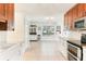 Bright kitchen featuring granite countertops, modern appliances, and seamless open-concept layout at 766 86Th N Ave, St Petersburg, FL 33702
