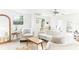 Bright living room with neutral colors, modern ceiling fan, and comfortable seating at 766 86Th N Ave, St Petersburg, FL 33702