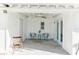 Covered patio featuring comfortable seating, a ceiling fan, and French doors at 766 86Th N Ave, St Petersburg, FL 33702