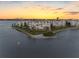 Waterfront condos with private beach access and manicured lawns create a resort-style ambiance at 8040 Sailboat Key S Blvd # 402, St Pete Beach, FL 33707