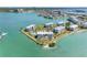 An aerial shot reveals the waterfront condos with a community pool and beautiful surrounding harbor views at 8040 Sailboat Key S Blvd # 402, St Pete Beach, FL 33707