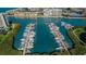 Aerial view showing the marina and waterfront access for residents and boaters, surrounded by beautiful water at 8040 Sailboat Key S Blvd # 402, St Pete Beach, FL 33707