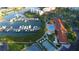 Aerial view showcasing the marina, clubhouse, pool, tennis courts, and surrounding landscape at 8040 Sailboat Key S Blvd # 402, St Pete Beach, FL 33707