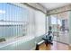 Water view from the balcony, with a rowing machine for exercise and access to the outside at 8040 Sailboat Key S Blvd # 402, St Pete Beach, FL 33707