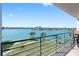 Relaxing balcony view overlooking the water, nearby park, and waterfront community at 8040 Sailboat Key S Blvd # 402, St Pete Beach, FL 33707
