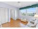 Bright bedroom with hardwood floors, a water view and two closets at 8040 Sailboat Key S Blvd # 402, St Pete Beach, FL 33707
