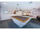Well-lit billiards room featuring two pool tables with overhead lighting and wall decor at 8040 Sailboat Key S Blvd # 402, St Pete Beach, FL 33707