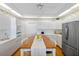 Bright, functional kitchen with plenty of cabinets, modern appliances, and a center island with seating at 8040 Sailboat Key S Blvd # 402, St Pete Beach, FL 33707