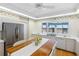 Bright eat-in kitchen features white appliances, ample counter space, and a lovely view at 8040 Sailboat Key S Blvd # 402, St Pete Beach, FL 33707