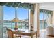 Cozy living room with a water view featuring a writing desk with ample natural light at 8040 Sailboat Key S Blvd # 402, St Pete Beach, FL 33707