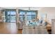 Inviting living room featuring water views, comfortable seating, and hardwood floors at 8040 Sailboat Key S Blvd # 402, St Pete Beach, FL 33707