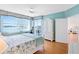 Spacious main bedroom features a walkout balcony, water view, and ensuite bath at 8040 Sailboat Key S Blvd # 402, St Pete Beach, FL 33707