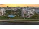 Community pool, surrounded by lush landscaping, providing a relaxing oasis for residents at 8040 Sailboat Key S Blvd # 402, St Pete Beach, FL 33707