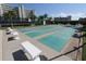 A view of the shuffleboard courts with benches and a well-maintained landscape, ideal for outdoor community activities at 8040 Sailboat Key S Blvd # 402, St Pete Beach, FL 33707