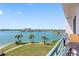 Stunning water views from a balcony with patio table and chairs, perfect for relaxing at 8040 Sailboat Key S Blvd # 402, St Pete Beach, FL 33707