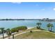 Expansive waterfront view showcasing the bay, coastline, and lush landscaping creating a peaceful setting at 8040 Sailboat Key S Blvd # 402, St Pete Beach, FL 33707