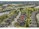 A high angle view of a home in a well-kept community with lush green landscaping and beautiful golf course views at 807 Chipper Dr, Sun City Center, FL 33573