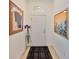 Entryway with tiled floors, decor, and artwork at 807 Chipper Dr, Sun City Center, FL 33573