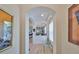 Bright foyer showcasing art niches, wood-look tile flooring and views into the kitchen and living areas at 807 Chipper Dr, Sun City Center, FL 33573