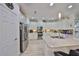 Bright kitchen features stainless steel appliances, white cabinetry, and a large island at 807 Chipper Dr, Sun City Center, FL 33573