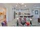 Inviting eat-in kitchen featuring barstool seating and views into the dining area and living spaces at 807 Chipper Dr, Sun City Center, FL 33573