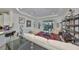 Living room with white sofas and decor on display shelving at 807 Chipper Dr, Sun City Center, FL 33573